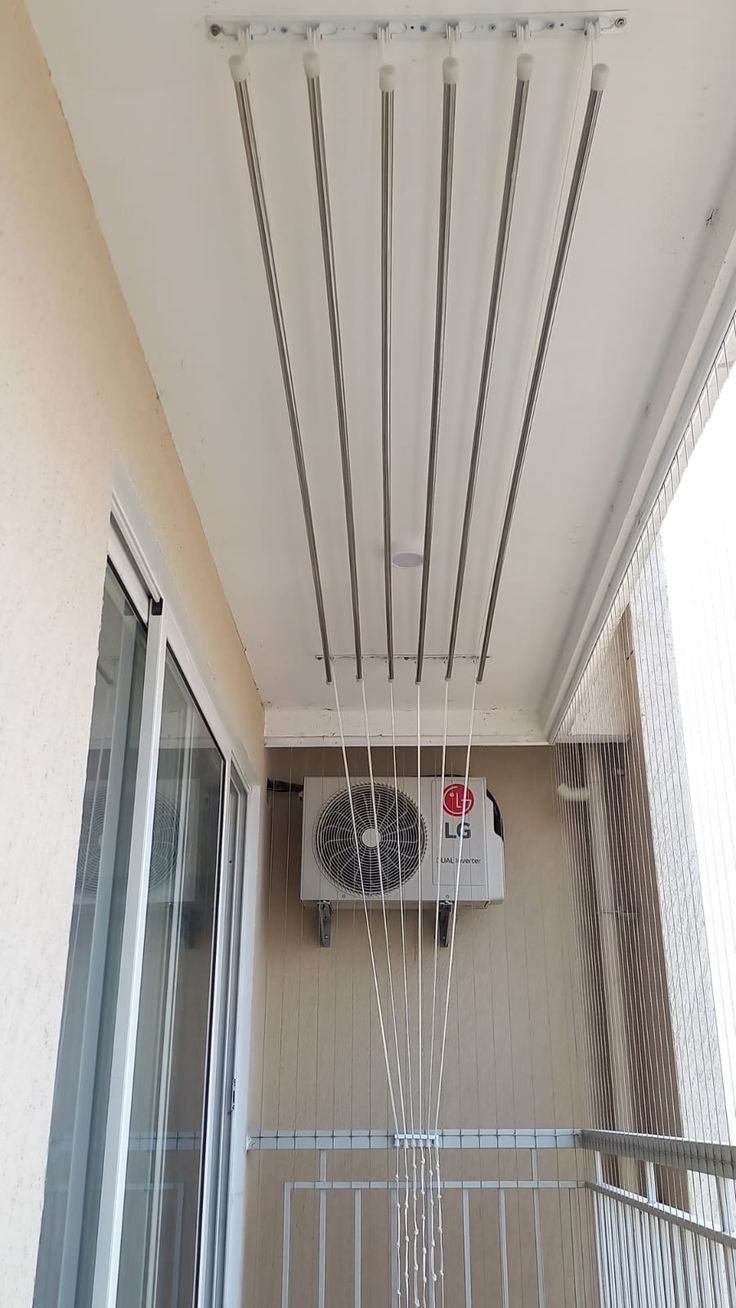 Ceiling ceiling cloth hanger system in laundry room